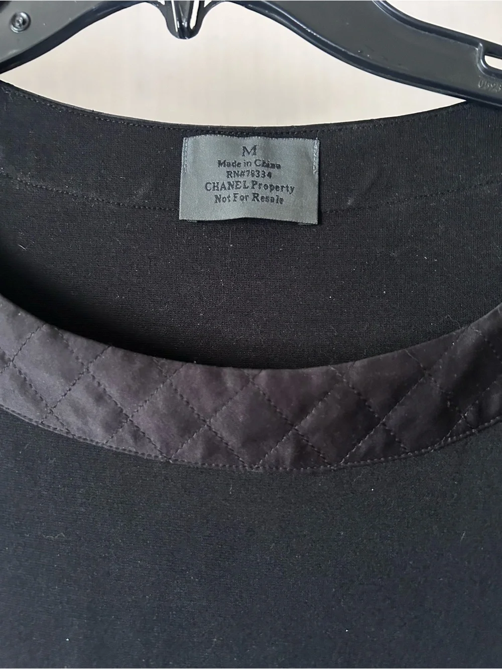 CHANEL black quilted boatneck employee uniform top
